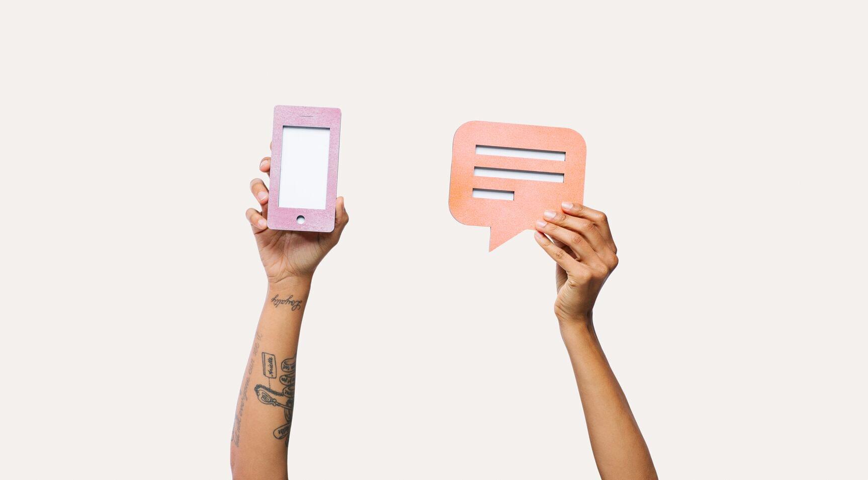 Hands with phone and messaging icons